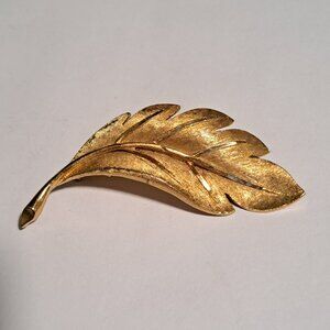 BSK vintage gold tone lead brooch